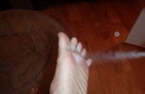 aerosol treatment of foot affected by fungus